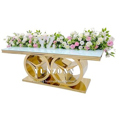 अच्छा दाम आधुनिक सोने का आयताकार डाइनिंग टेबल बेंज़ बेस लक्जरी वेडिंग इवेंट फर्नीचर आउटडोर और होटल उपयोग ग्लास/एमडीएफ टॉप के साथ ऑनलाइन